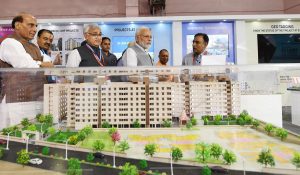 The Prime Minister, Shri Narendra Modi visiting an exhibition on Flagship Missions of Urban Development during the event Transforming Urban Landscape: Third Anniversary of Pradhan Mantri Awas Yojana (Urban), Atal Mission for Rejuvenation of Urban Transformation (AMRUT) and the Smart Cities Mission, in Lucknow, Uttar Pradesh on July 28, 2018. The Union Home Minister, Shri Rajnath Singh, the Chief Minister of Uttar Pradesh, Yogi Adityanath and the Secretary, Ministry of Housing and Urban Affairs, Shri Durga Shanker Mishra are also seen.