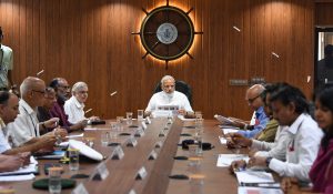 The Prime Minister, Shri Narendra Modi chairing a high level meeting with the officials to take stock of the flood rescue and relief operations, at Kochi, in Kerala on August 18, 2018. The Governor of Kerala, Justice (Retd.) P. Sathasivam and the Minister of State for Tourism (I/C), Shri Alphons Kannanthanam are also seen.