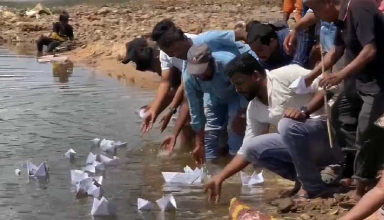 Aspirants RI & Amin exam  discontent by folding their admit cards into paper boats and floating them down the Kathajodi River